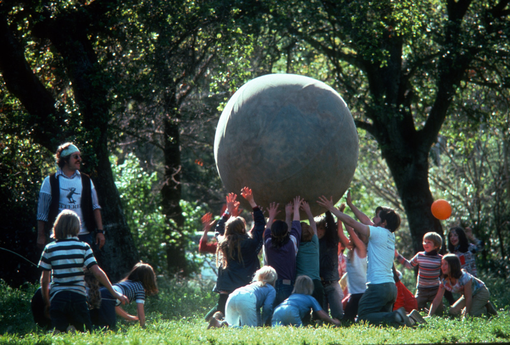 Group of players lifting an Earthball